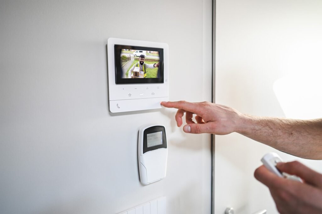 A collage of security concepts, including a person using an intercom, a keycard access control panel, and an operator performing virtual doorman services for GCCTVMS.