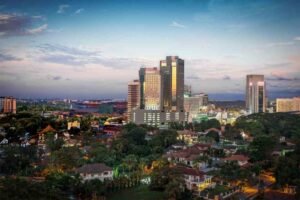 A panoramic view of the Johor Bahru skyline at dusk, highlighting the commercial districts where JB businesses must now comply with the new CCTV mandate