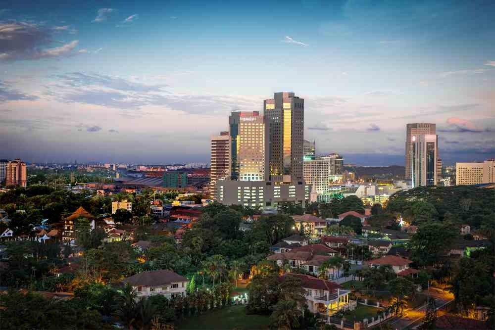 A panoramic view of the Johor Bahru skyline at dusk, highlighting the commercial districts where JB businesses must now comply with the new CCTV mandate