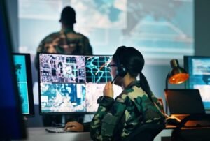 A professional operator in a high-tech command center providing Remote Doorman Services, including Virtual Doorman Services and Doorman Services with real-time video monitoring