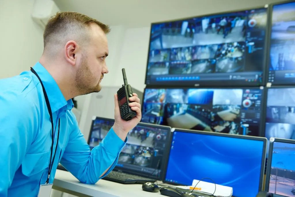 GCCTVMS remote guarding services operator monitoring live video feeds with real-time threat detection and two-way audio response