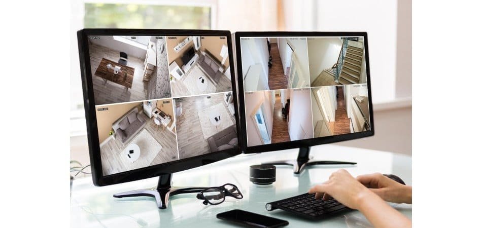 GCCTVMS operator providing live security monitoring service watching real-time CCTV camera feeds with threat detection and two-way audio response. indoor surveillance. Remote Monitoring Solutions