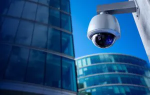 Outdoor dome security camera mounted on a building, providing 24/7 surveillance for business security in Singapore. Professional CCTV monitoring services for modern commercial buildings with advanced surveillance technology.