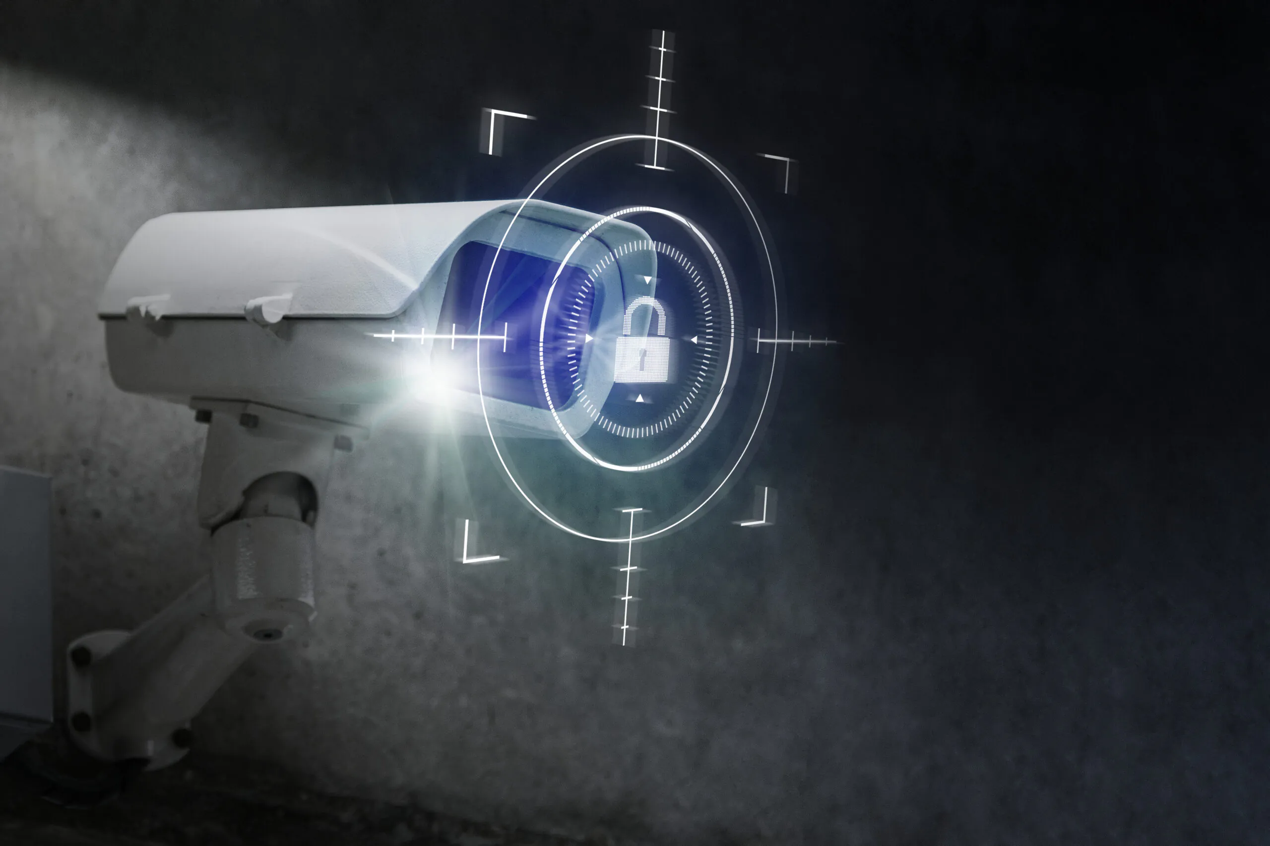 A white security camera with a glowing blue digital overlay showing a lock icon and targeting reticles, symbolizing high-tech, secure CCTV Surveillance and data protection.