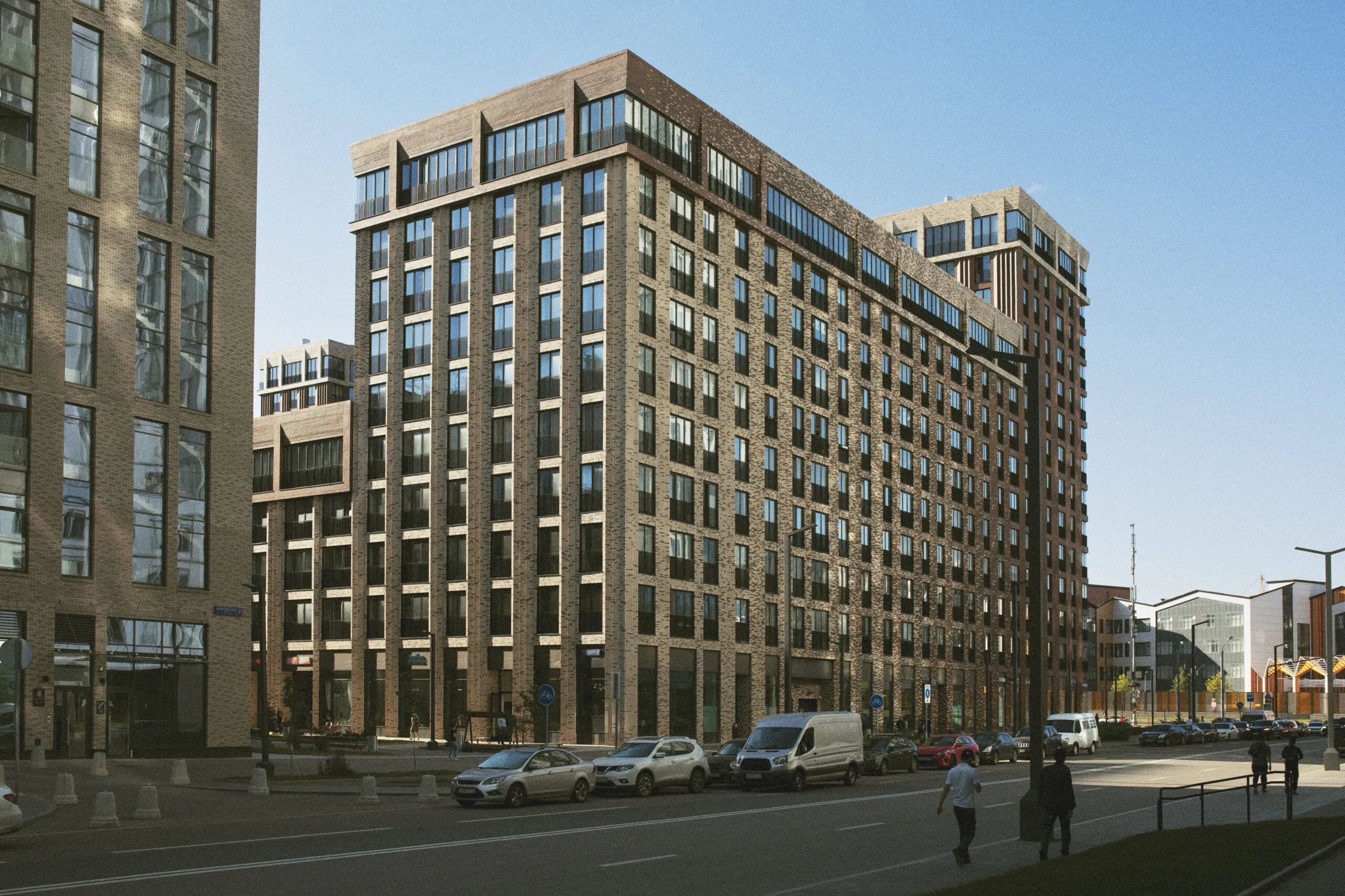 Large, modern multi-story apartment or office building on a city street. Ideal for property-wide two-way audio access control.