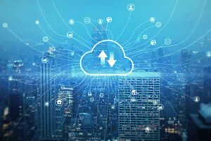 A cityscape at night featuring a central glowing cloud icon with network connections, symbolizing the use of cloud storage for accessing CCTV footage and real-time video surveillance data