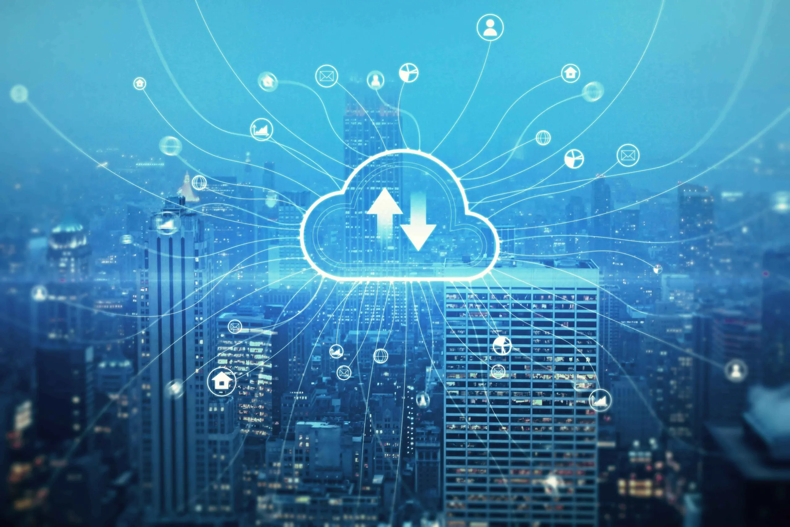 A cityscape at night featuring a central glowing cloud icon with network connections, symbolizing the use of cloud storage for accessing CCTV footage and real-time video surveillance data
